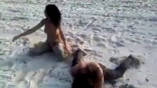 Two crazy naked girls on the beach