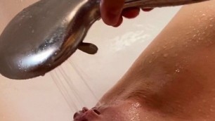 teen masturbates her pink pussy with fingers and water jet